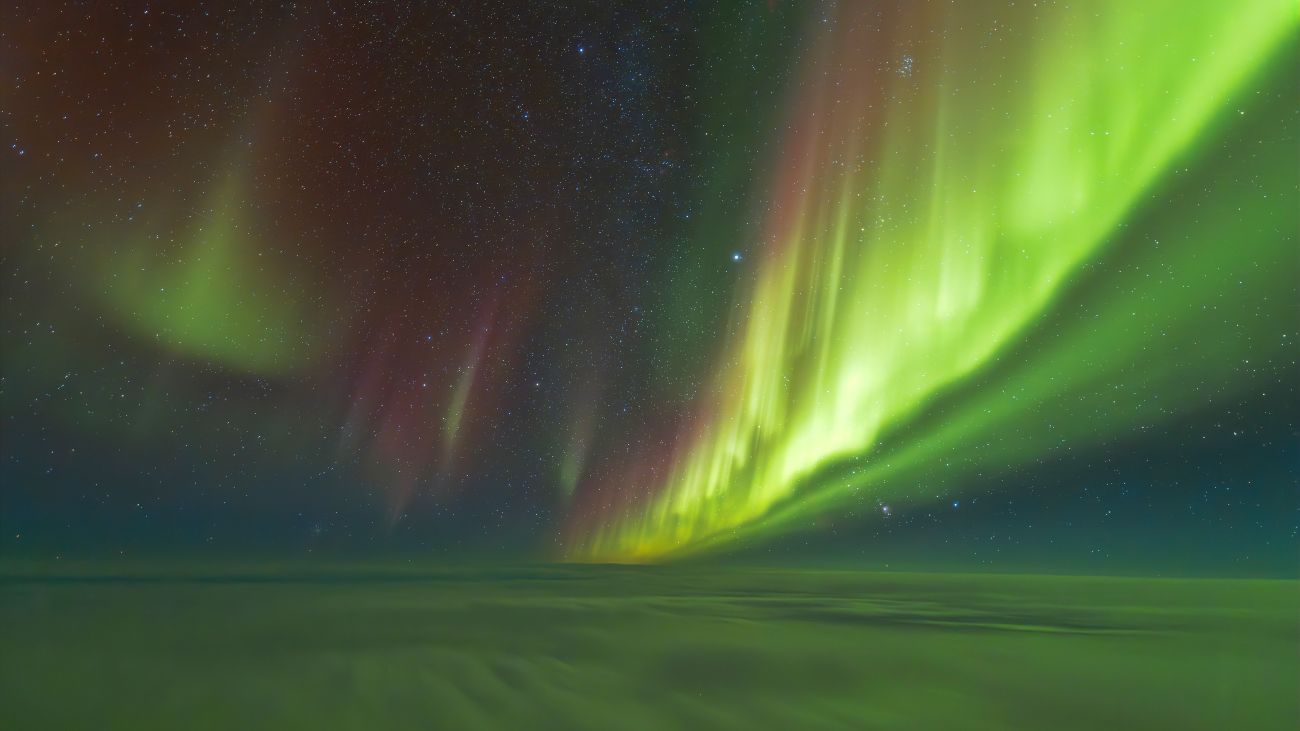 Noorderlicht boven de wolken