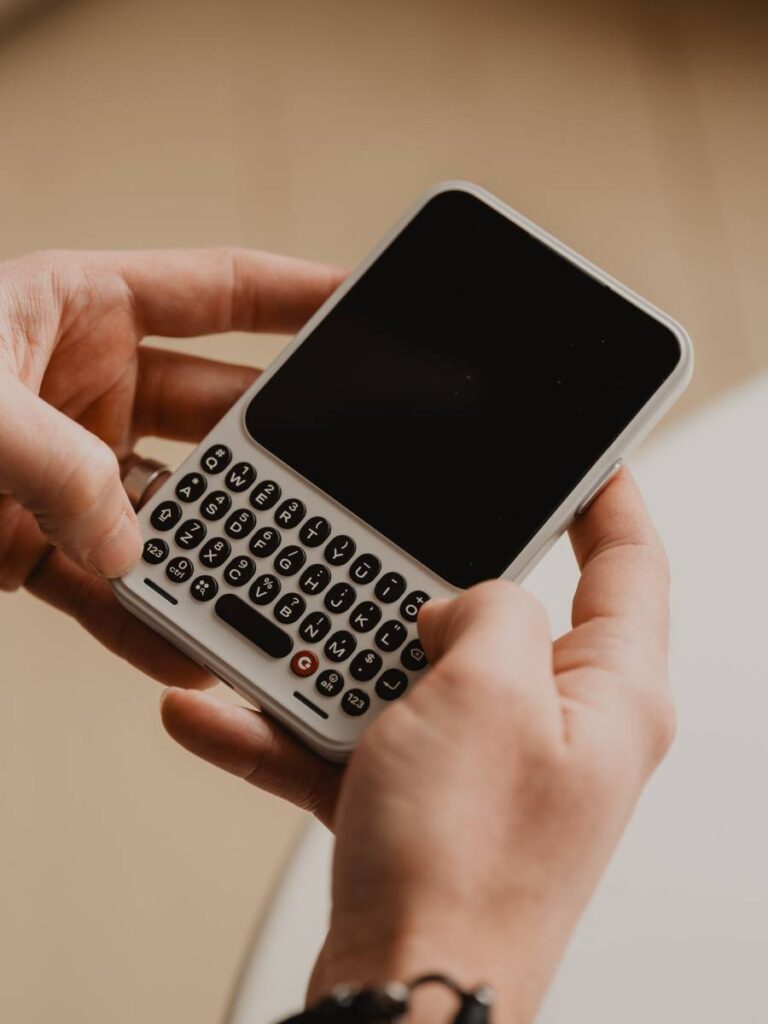 Communicator, smartphone met toetsen